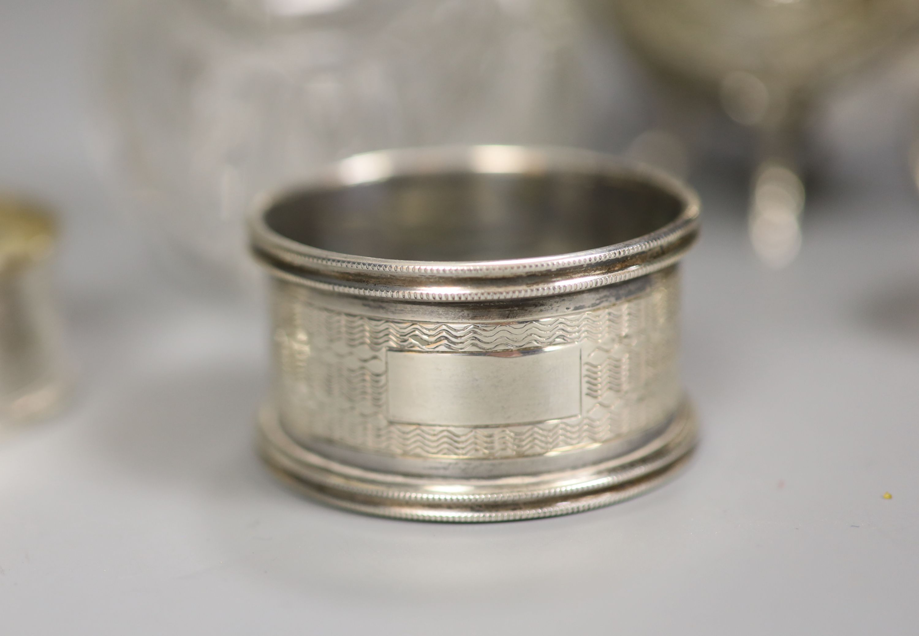 An Edwardian silver and glass globular scent bottle, a Continental cauldron shaped salt and four napkin rings